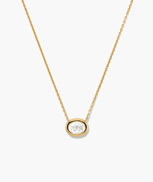 Colar dourado com pingente oval de cristal