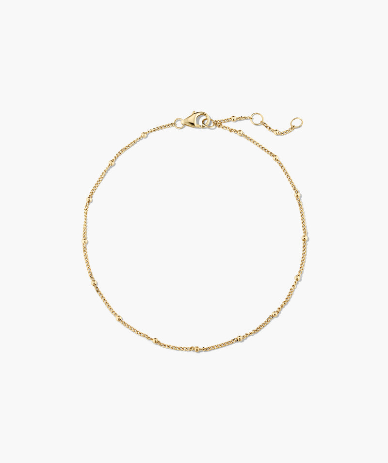 Pulseira dourada com esferas