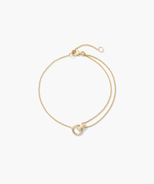 Pulseira dourada com elos entrelaçados